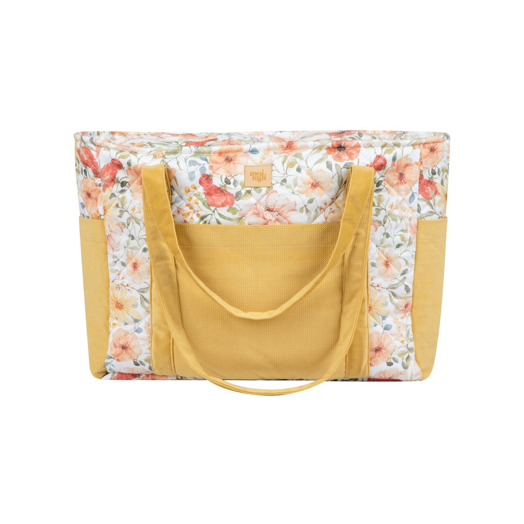 2. Studio shot of yellow and floral weekender bag with multiple pockets and moi mili logo