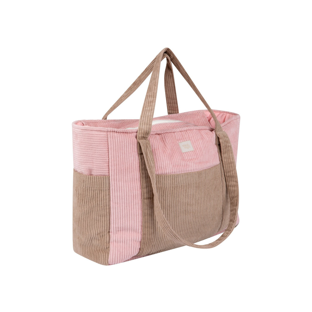 5. Side view of pink and coffee-colored weekender bag with dual handles in studio setting