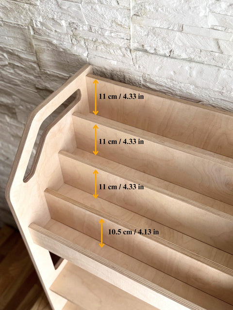 3. Close-up of top shelves on Montessori book display showing smooth birch plywood finish