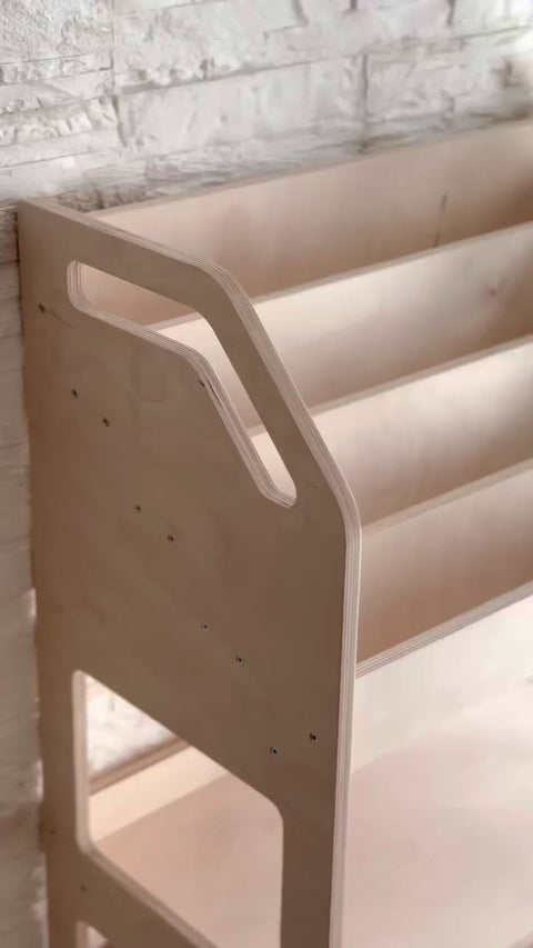 2. Side view of Montessori-style wooden book display showing smooth edges and minimalist design
