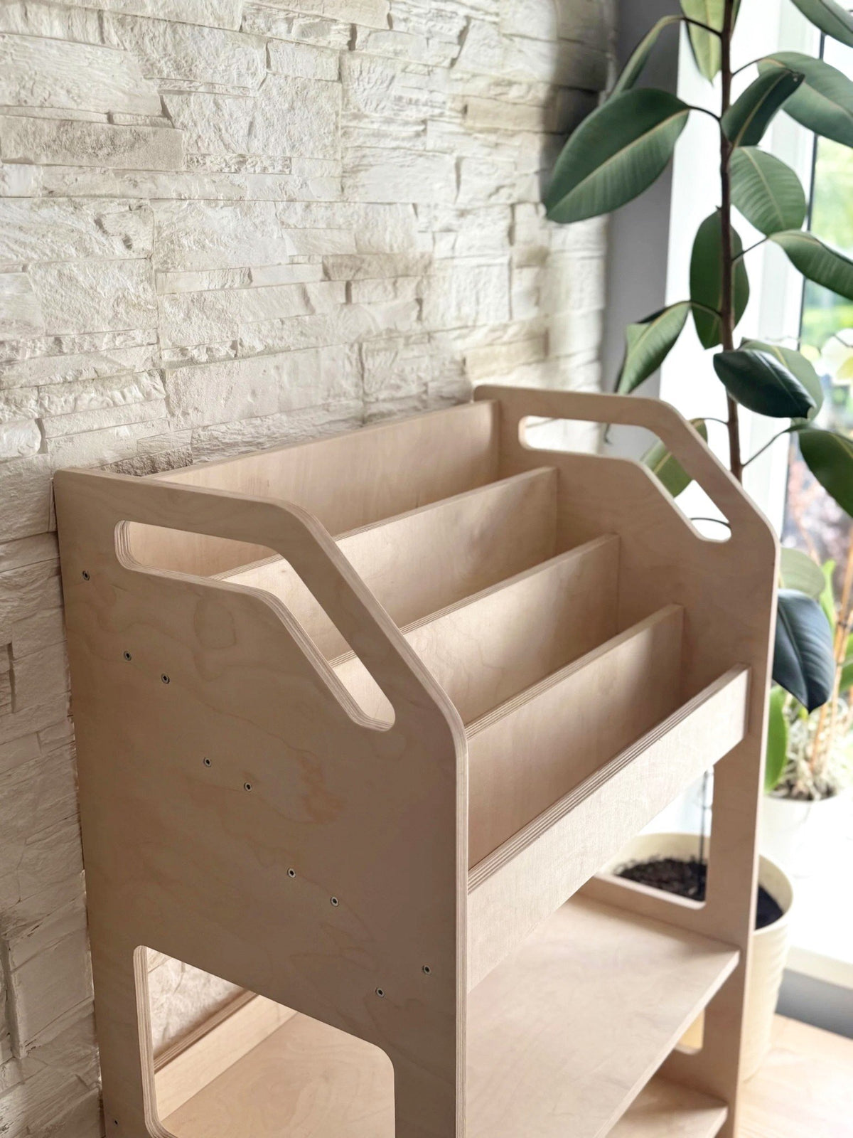 2. Side view of Montessori-style wooden book display showing smooth edges and minimalist design