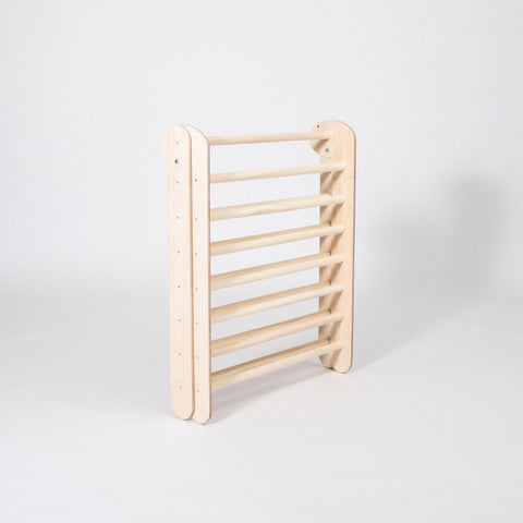 4. Folded Montessori Climbing Triangle in studio setting highlighting its compact storage capability