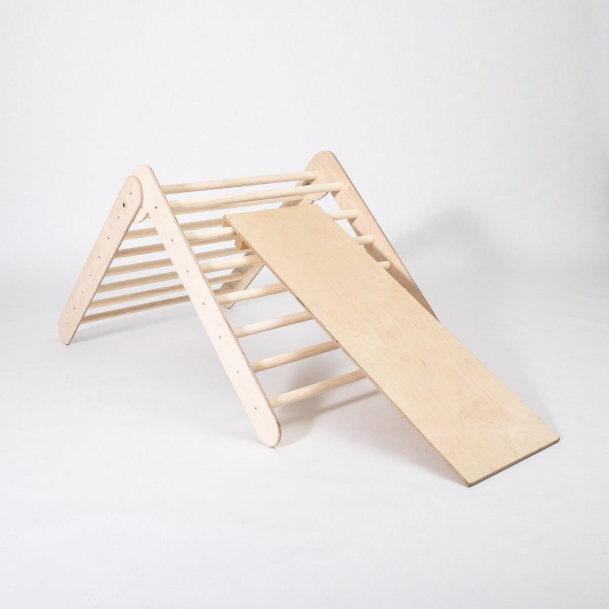 2. Montessori climbing triangle with ramp on white background, showing foldable design and climbing rings