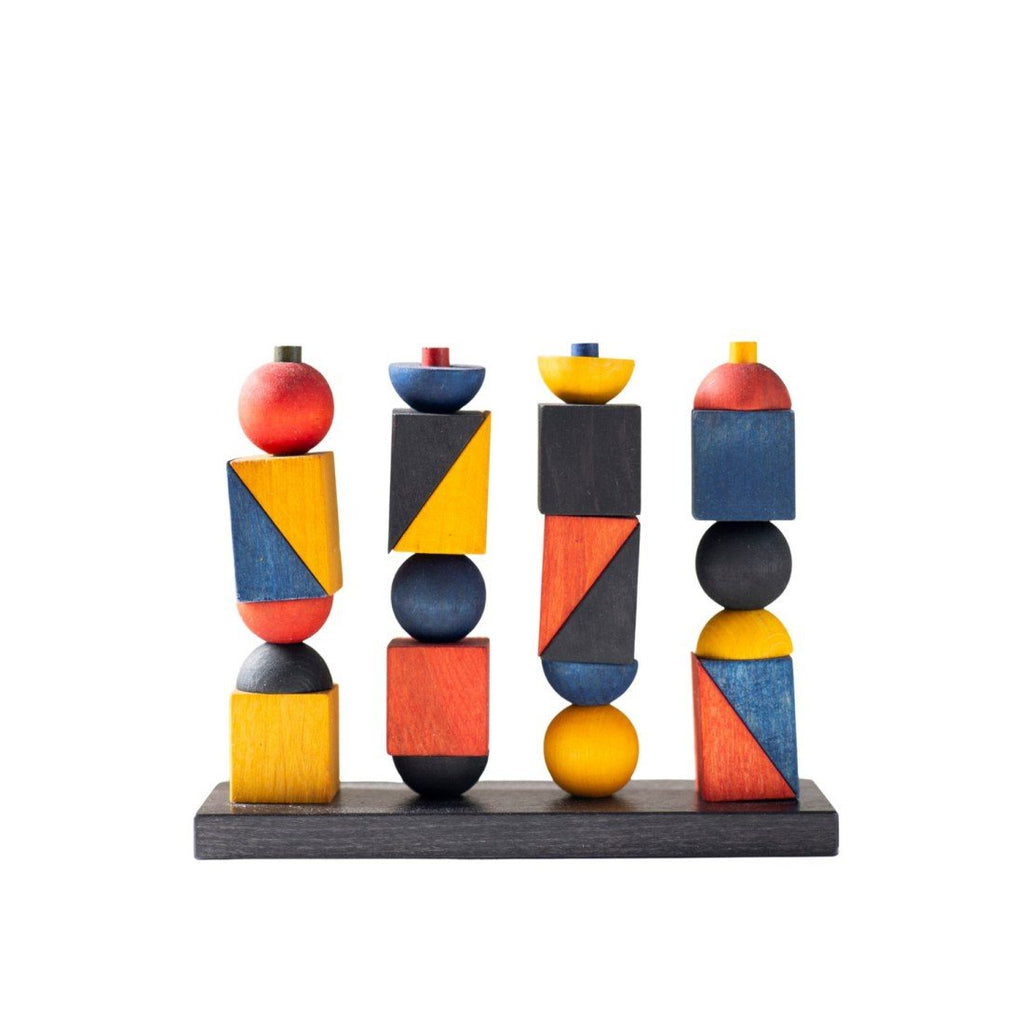 2. Montessori-inspired stacking toy with geometric shapes in red, blue, yellow, and black on a white background