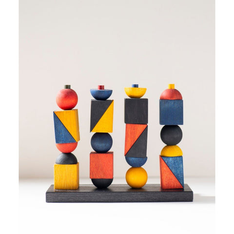 2. Studio shot of Montessori-inspired stacking toy with colorful geometric shapes on a neutral background