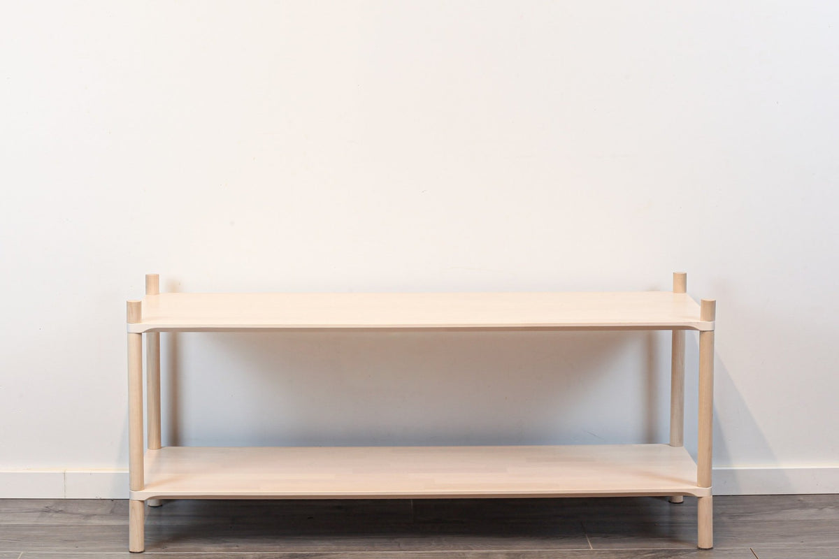 3. Front view of Montessori-inspired wooden shelving unit with two shelves, showcasing minimalist design and rounded corners