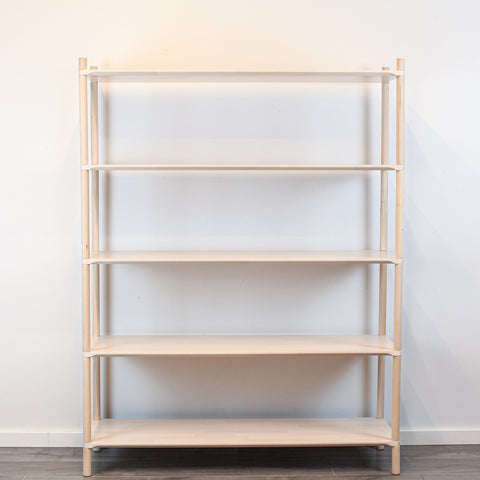 2. Studio shot of large Montessori-inspired wooden shelving unit with five empty shelves against a white background