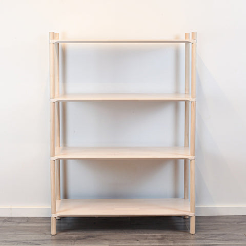 2. Studio shot of Montessori-inspired wooden shelving unit with four empty shelves, made from natural birch wood