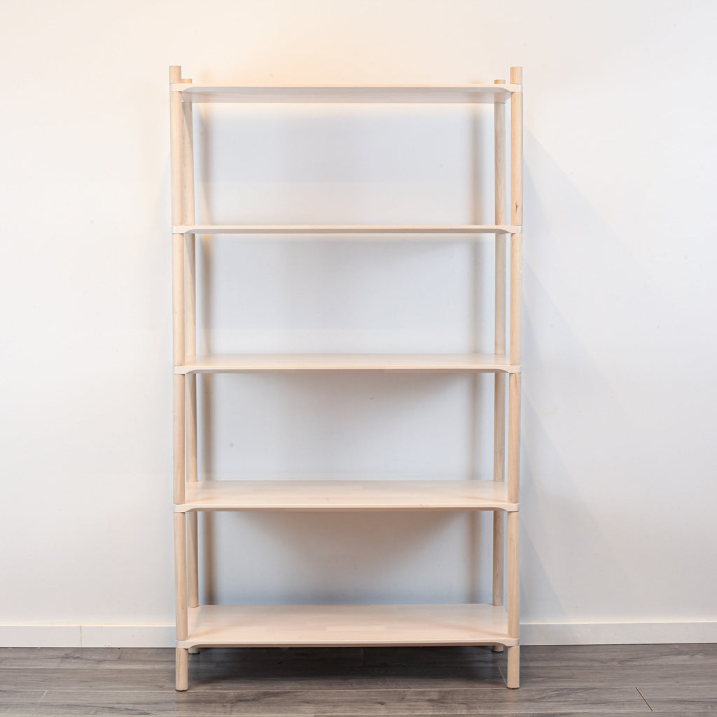 3. Front view of Montessori-inspired wooden shelving unit with five shelves, showcasing simple and practical design
