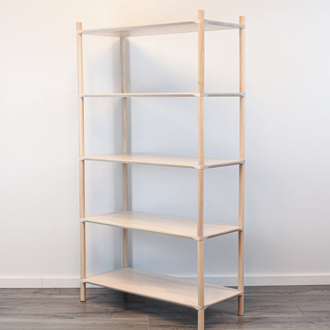2. Studio shot of Montessori-inspired wooden shelving unit with five shelves, made from natural birch wood