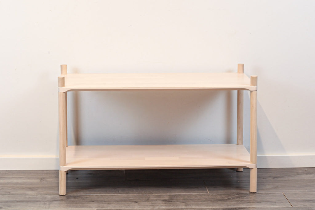 3. Front view of Montessori-inspired wooden shelving unit with two shelves, highlighting simple design and natural birch wood