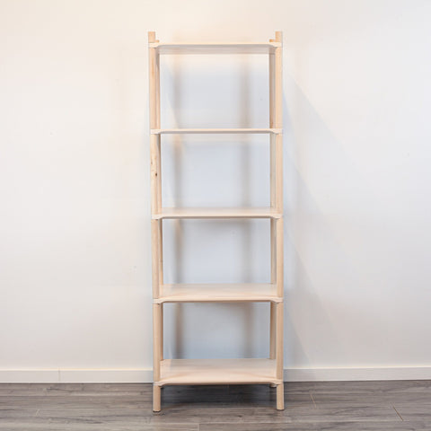 3. Front view of Montessori-inspired wooden shelving unit with five shelves, crafted from natural birch wood, displayed against a white wall