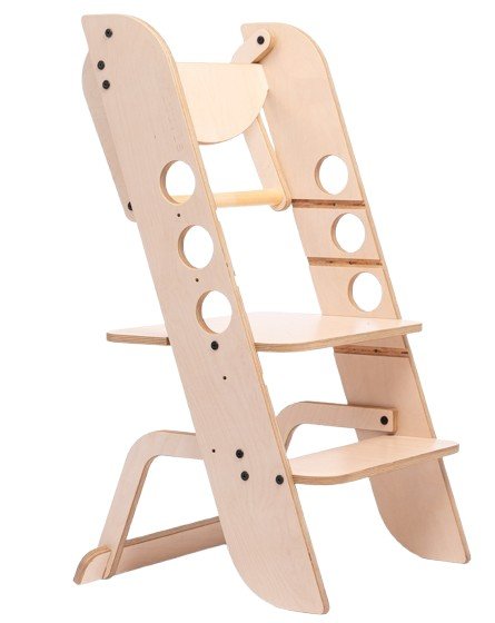 2. Wooden Montessori learning tower with circular cutouts and adjustable platform