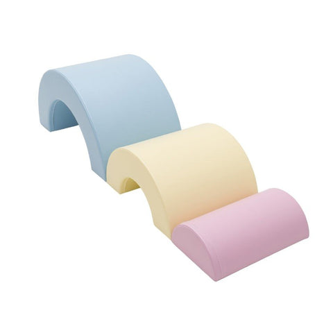 3. Detail shot of Montessori soft play set in light pastel colors, featuring blue, yellow, and pink foam arches arranged in a wave pattern