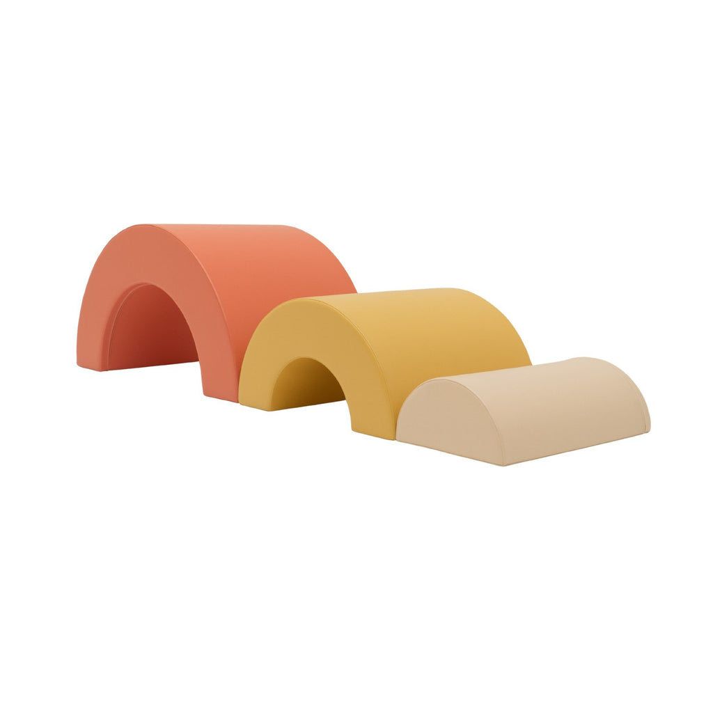 2. Montessori soft play set with three arch pieces in pastel pink, yellow, and beige on white background