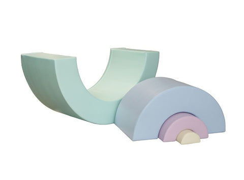 4. Studio shot of pastel rainbow soft play set pieces arranged in a curve