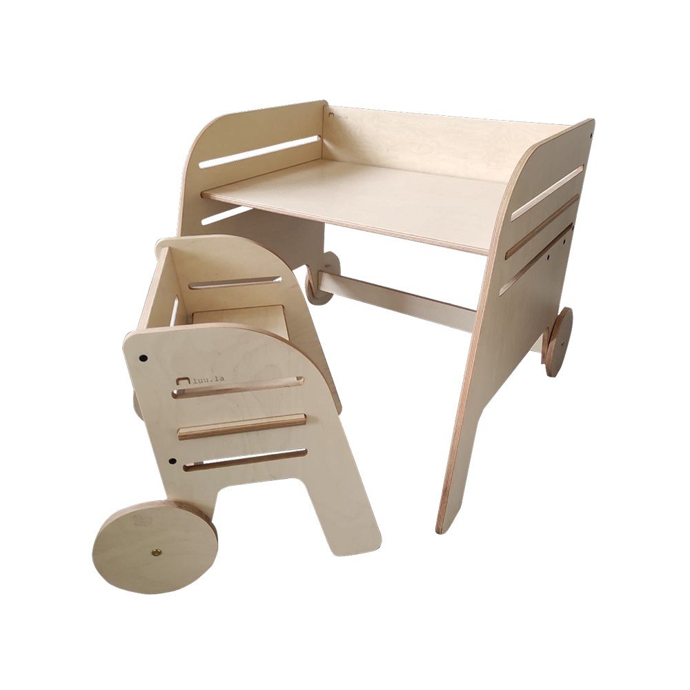 2. Studio shot of Luula Montessori table and chair set in birch plywood with opal white laminate finish, showing adjustable height design and oiled edges