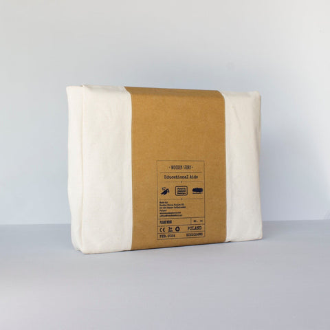 4. Flat lay of Montessori tray packaging in ecological cotton case with brown label