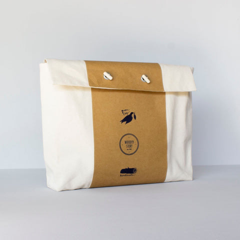 4. Flat lay of Montessori tray packaging in ecological cotton case with button closure and branding