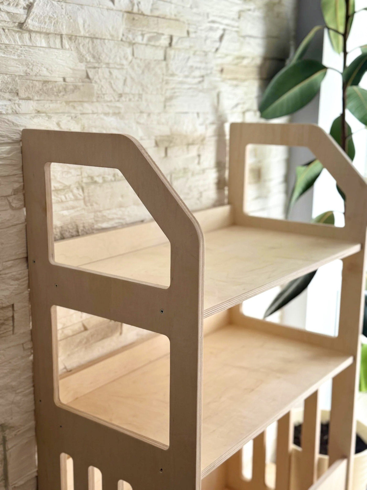 2. Studio shot of Montessori wooden shelf highlighting two open shelves and deep bottom compartment