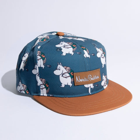 1. Moomin Adventure Kids Flat Cap in blue and brown with Moomin characters, featuring Nordic Buddies logo, shown in studio