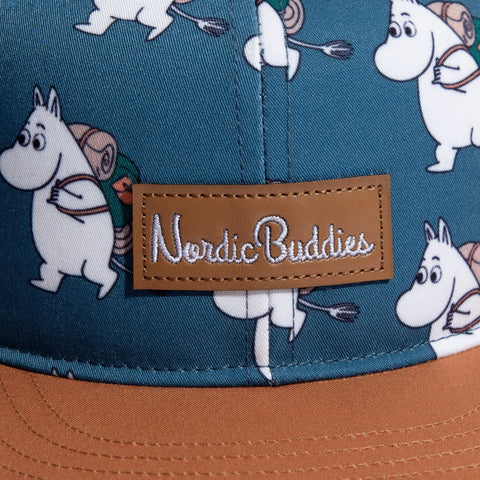 2. Close-up of Nordic Buddies logo on Moomin Adventure Kids Flat Cap with Moomin character pattern