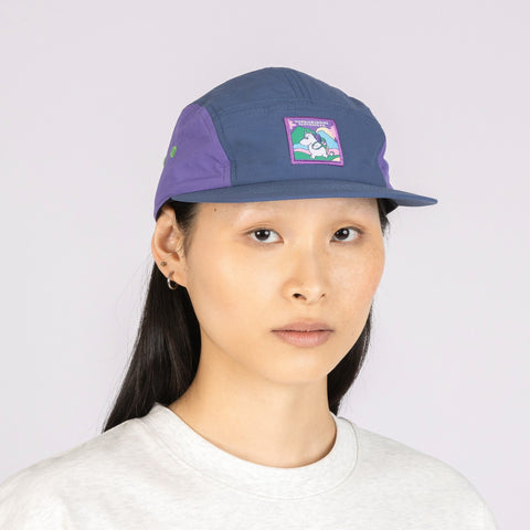 1. Women's Moomintroll Adventure Nylon 5-panel Cap in blue and lilac worn by model, front view