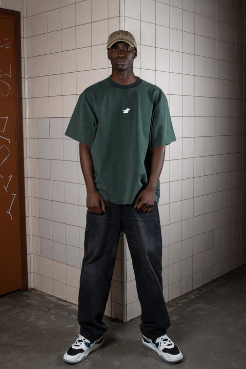 1. Men's khaki Moomin Classics Denim Dad Cap by NordicBuddies worn with green t-shirt in urban setting