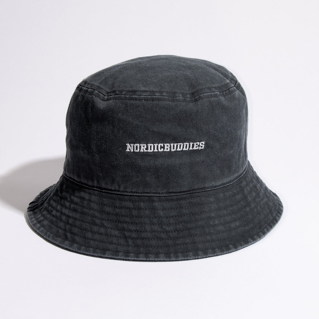 5. Studio image of black washed denim bucket hat with NordicBuddies logo