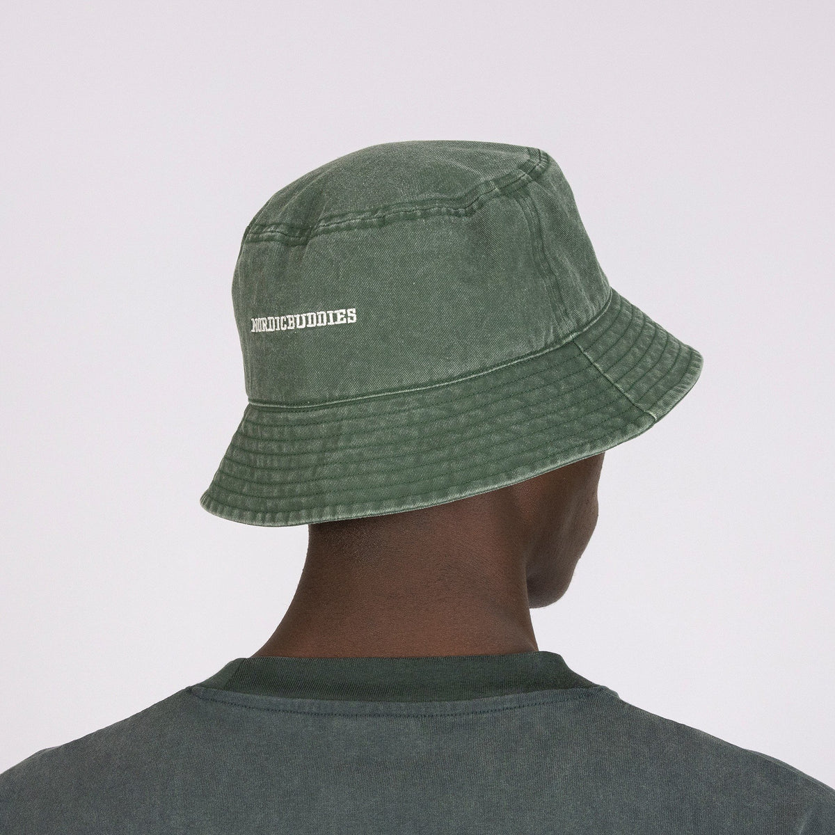 5. Back view of men's green Moomin Classics washed denim bucket hat with NordicBuddies branding