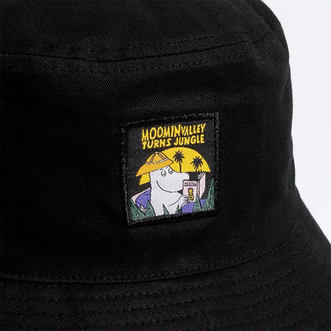 4. Close-up of Moomin Jungle patch on black bucket hat, showing Moomin character and jungle theme