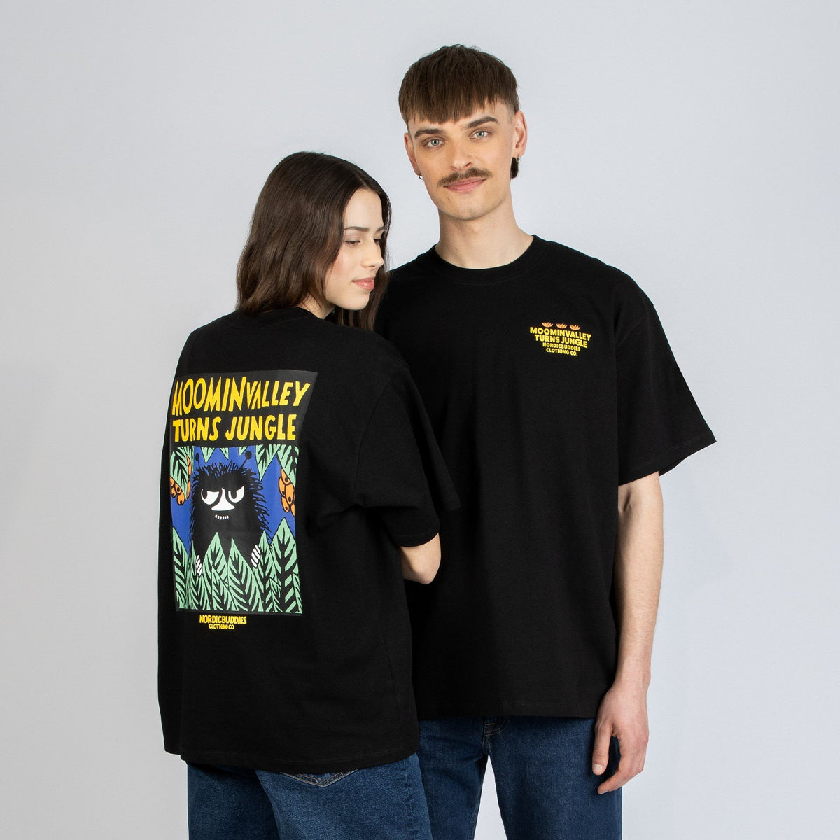 1. Unisex Moomin Jungle t-shirt worn by male and female models in studio, showcasing front and back design