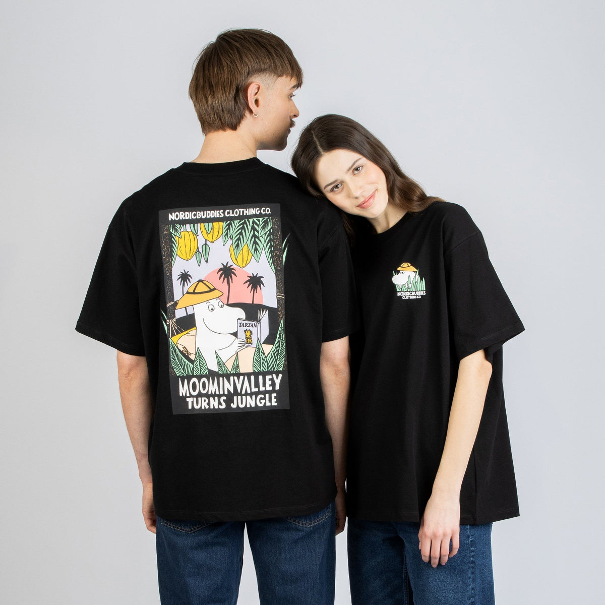 1. Unisex black Moomin Jungle t-shirt worn by male and female models, featuring bold back design and small front logo