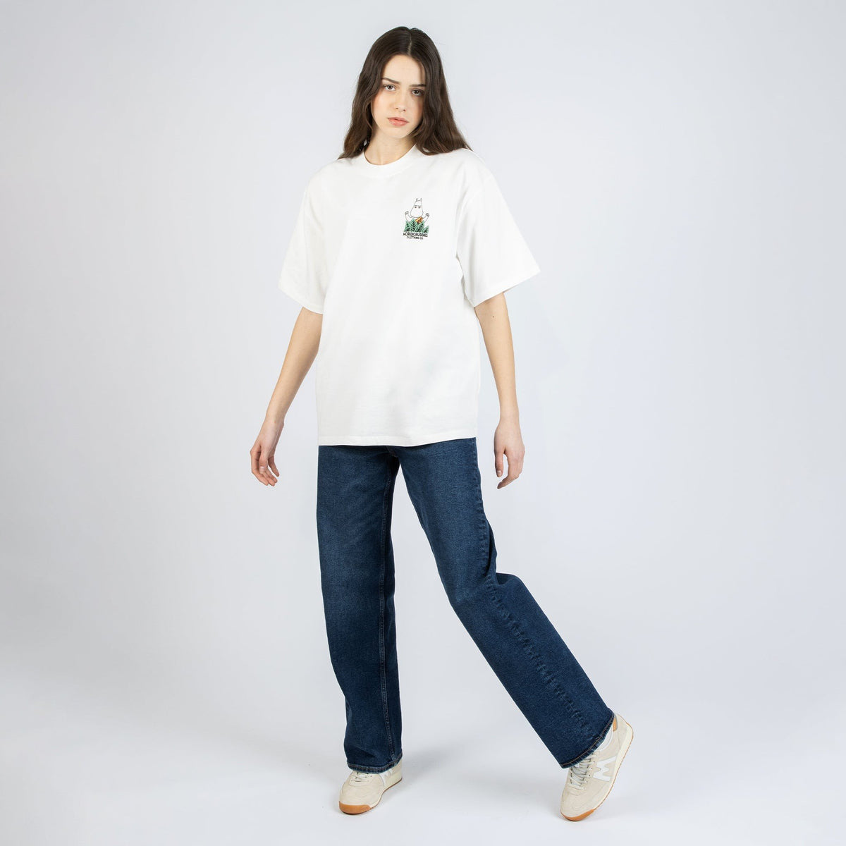 2. Women's white Moomin Jungle t-shirt styled with jeans, shown in studio setting