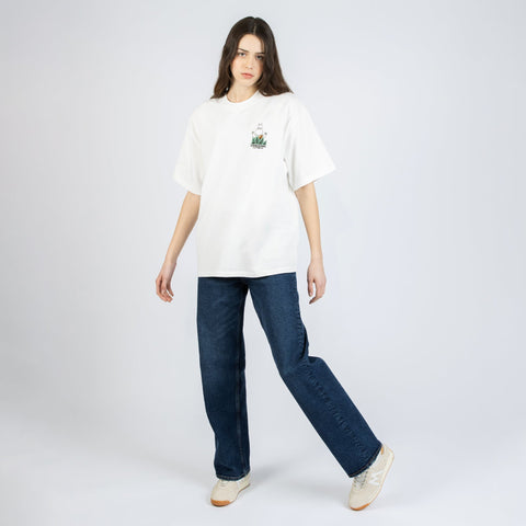 2. Women's white Moomin Jungle t-shirt styled with jeans, shown in studio setting