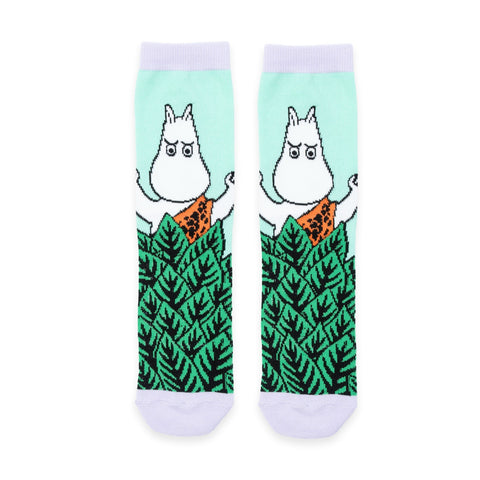 2. Flat lay of Moomin Jungle women's retro socks in vibrant green with whimsical Moomin character and jungle leaf pattern