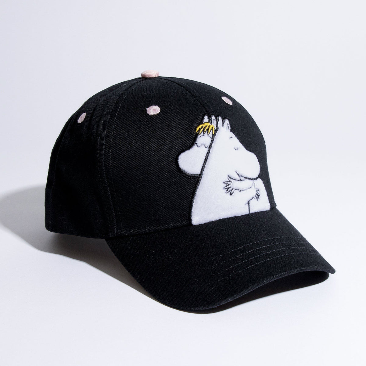 1. Moomin Love kids' cap in black with embroidered Moomin characters, studio shot