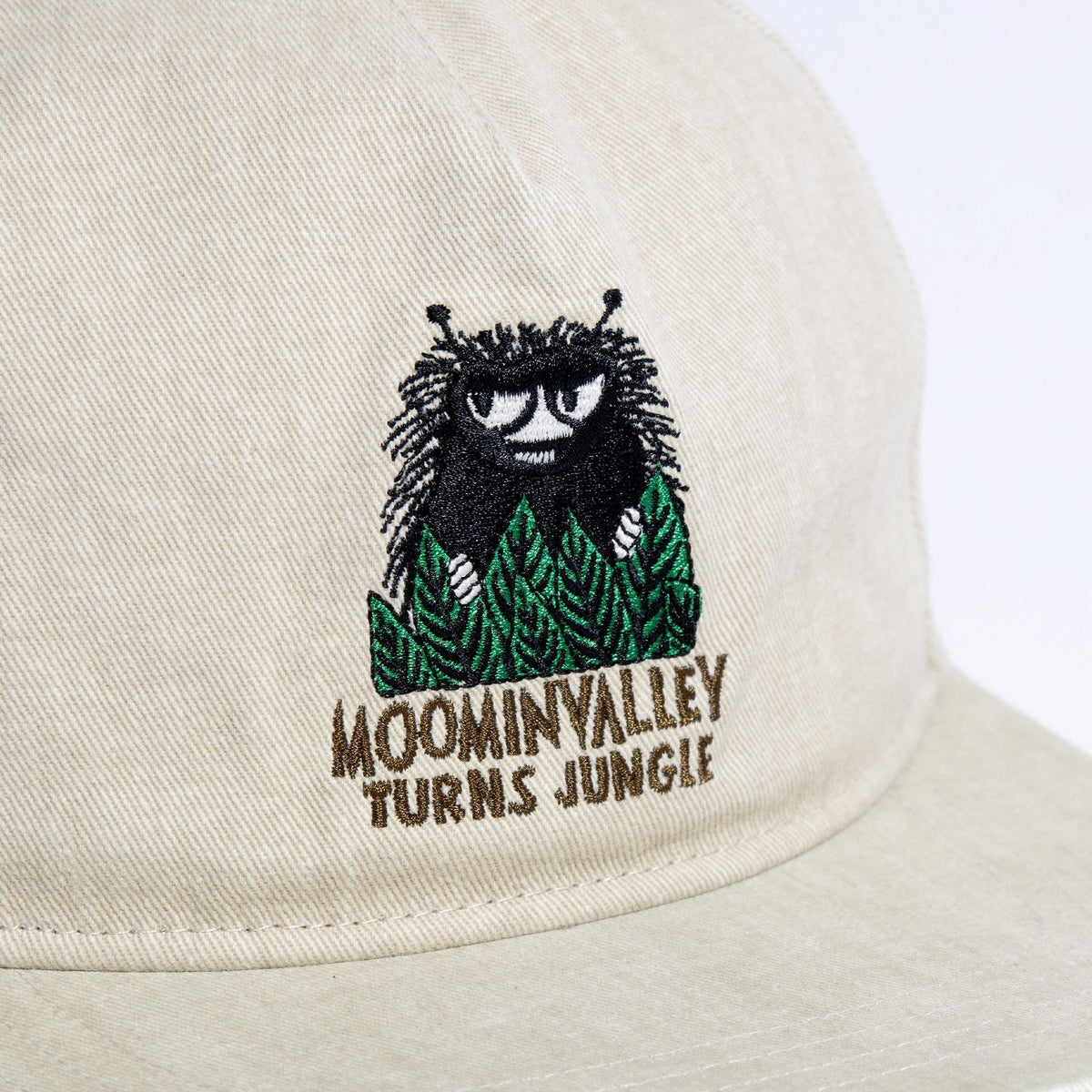 4. Close-up of Moominvalley Turns Jungle embroidery on beige denim cap