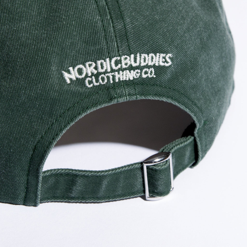 5. Close-up of NordicBuddies logo and adjustable strap on Denim Green Moomin cap