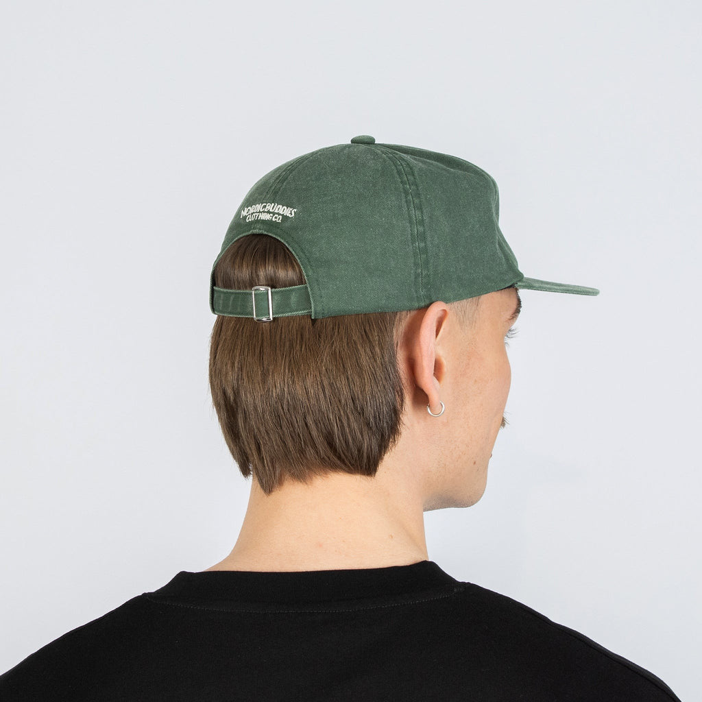 2. Male model showing back view of Moomin Washed Denim Adult Cap in Denim Green with adjustable strap