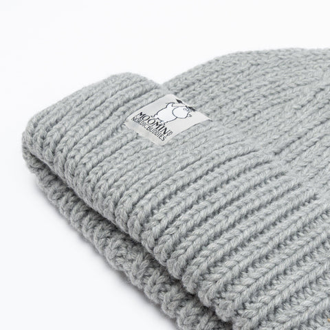 3. Close-up of grey Moominpappa chunky beanie showing ribbed texture and Moomin by NordicBuddies logo on brim