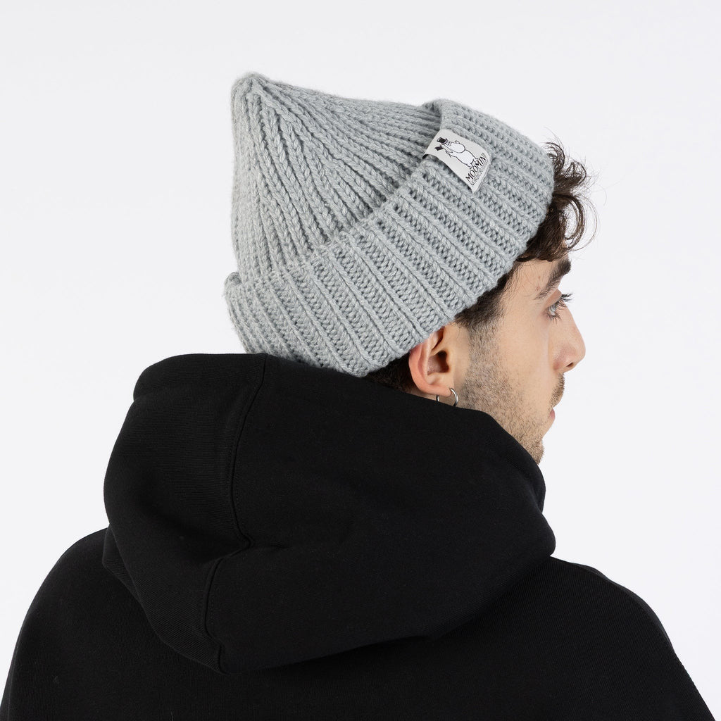 1. Man wearing grey Moominpappa chunky beanie with ribbed texture, shown from back, paired with black hoodie