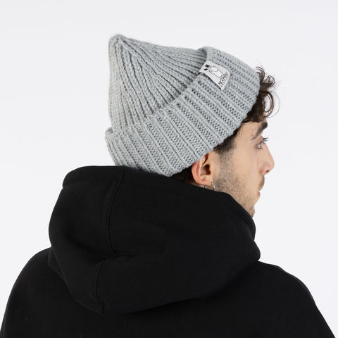 1. Man wearing grey Moominpappa chunky beanie with ribbed texture, shown from back, paired with black hoodie