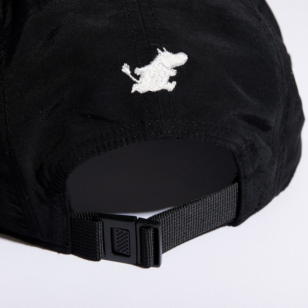 5. Close-up of adjustable strap and Moomintroll embroidery on black 5-panel cap