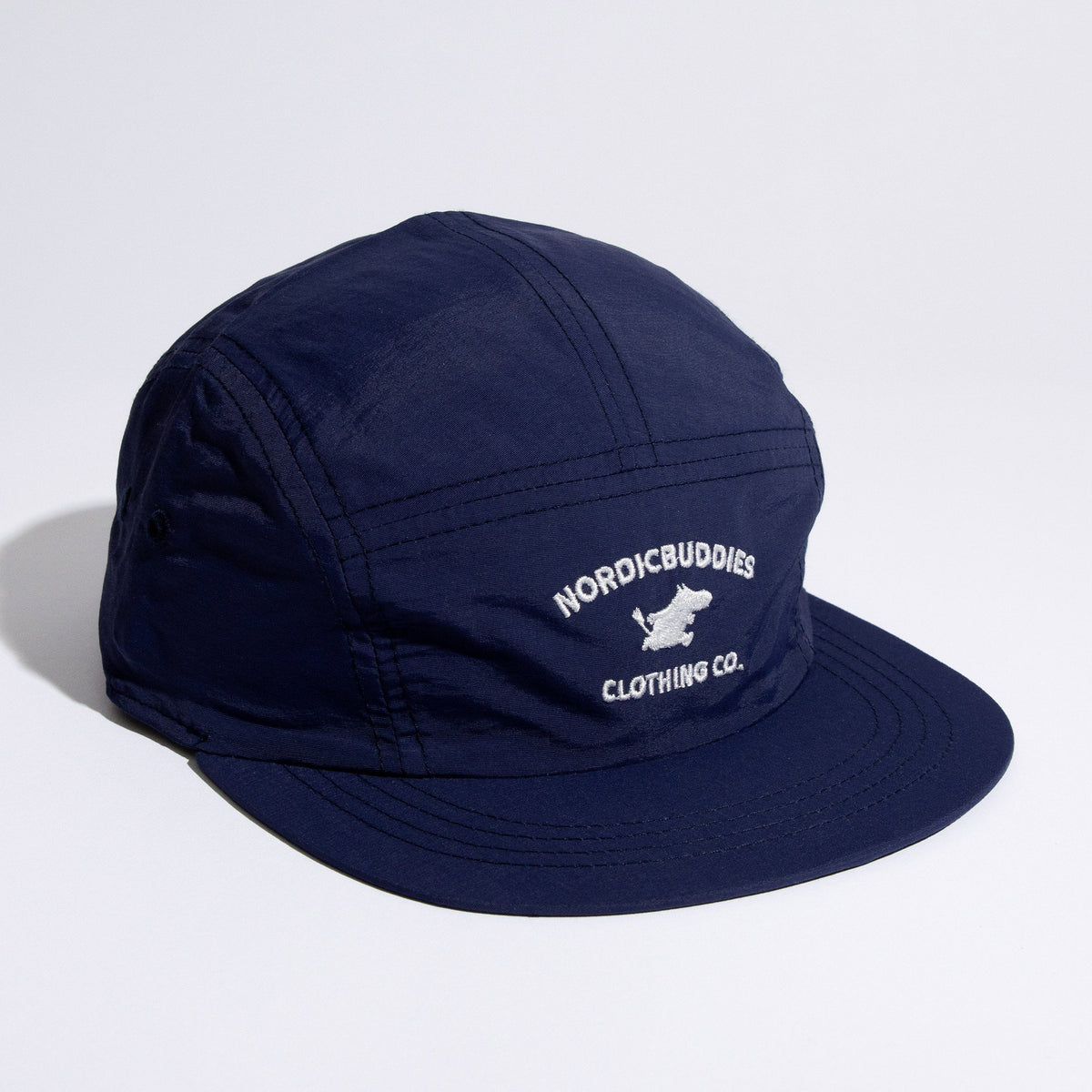 2. Studio shot of navy Moomintroll Adventure 5-panel cap by NordicBuddies, showing front logo
