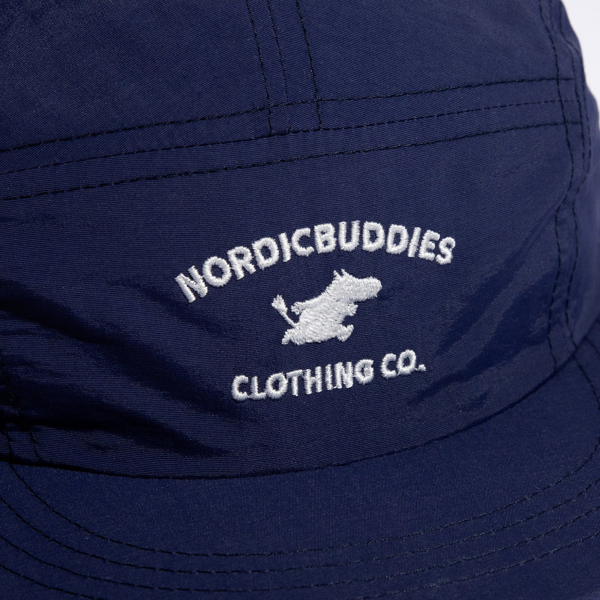 3. Close-up of NordicBuddies logo on navy Moomintroll Adventure 5-panel cap