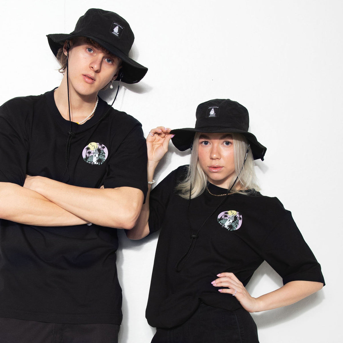 1. Unisex Moomintroll Brimmer Hat in black worn by male and female models, showcasing versatile style