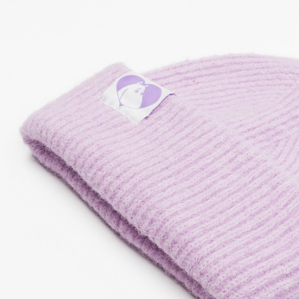 3. Close-up of lilac Moomintroll beanie showing ribbed texture and Moomin logo patch