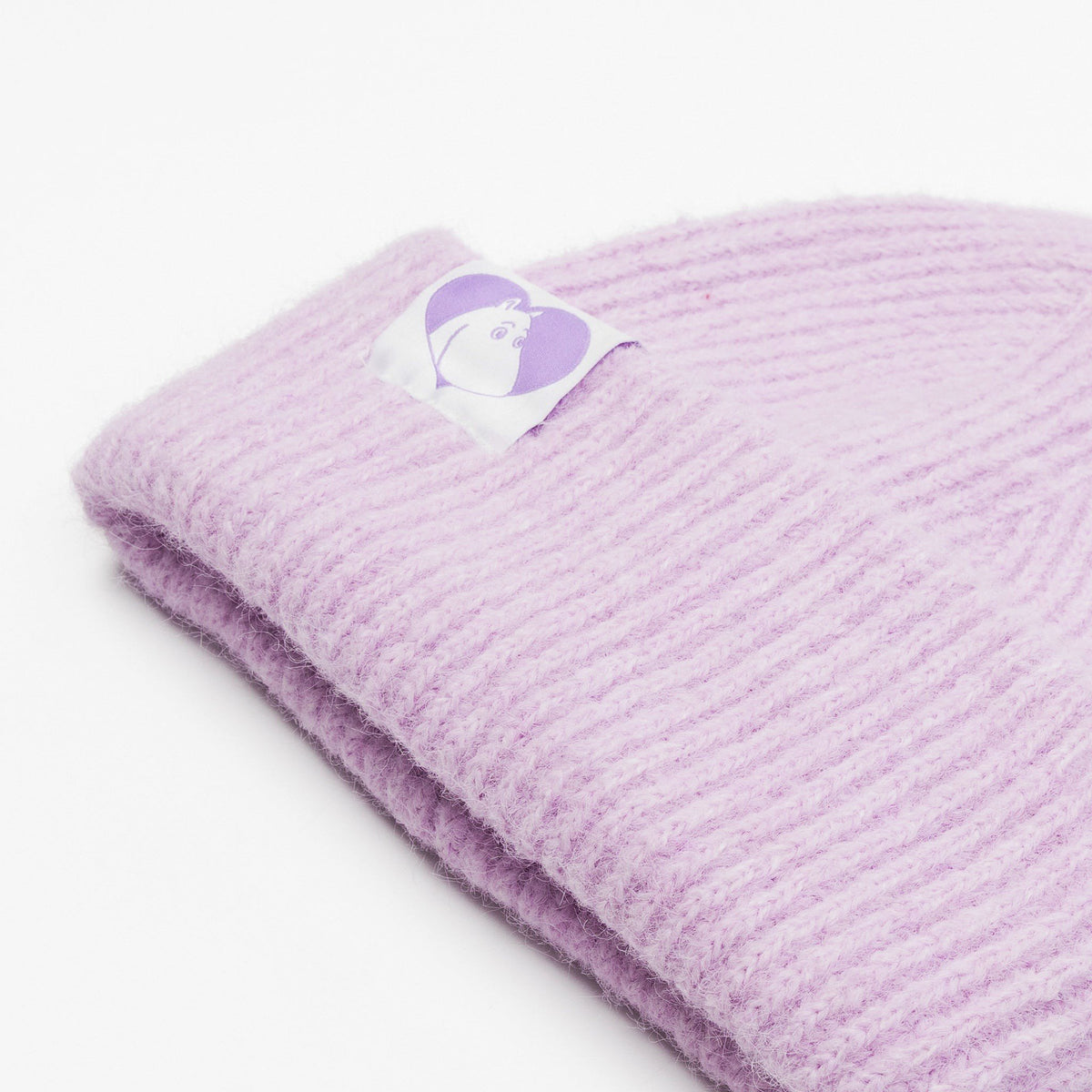 3. Close-up of lilac Moomintroll beanie showing ribbed texture and Moomin logo patch