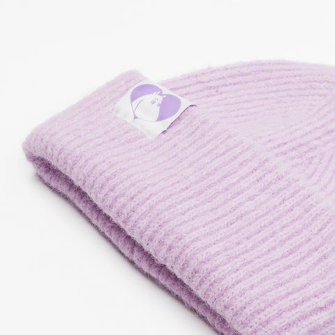 3. Close-up of lilac Moomintroll beanie showing ribbed texture and Moomin logo patch